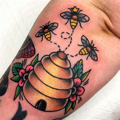 Beehive tattoo - Try “ Tattoo Balm ”. This queen bee tattoo, crafted with precise black ink, symbolizes the remarkable power of leadership and strength that bees embody. It is a perfect depiction of a strong and fearless queen bee. Bees are known for their dauntless nature, and this tattoo is the perfect way to represent that. If you feel like a true queen ...